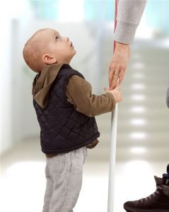 boy looking up at parent