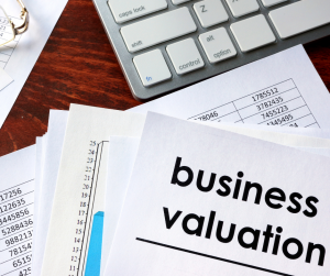 desk with financial forms, business valuation